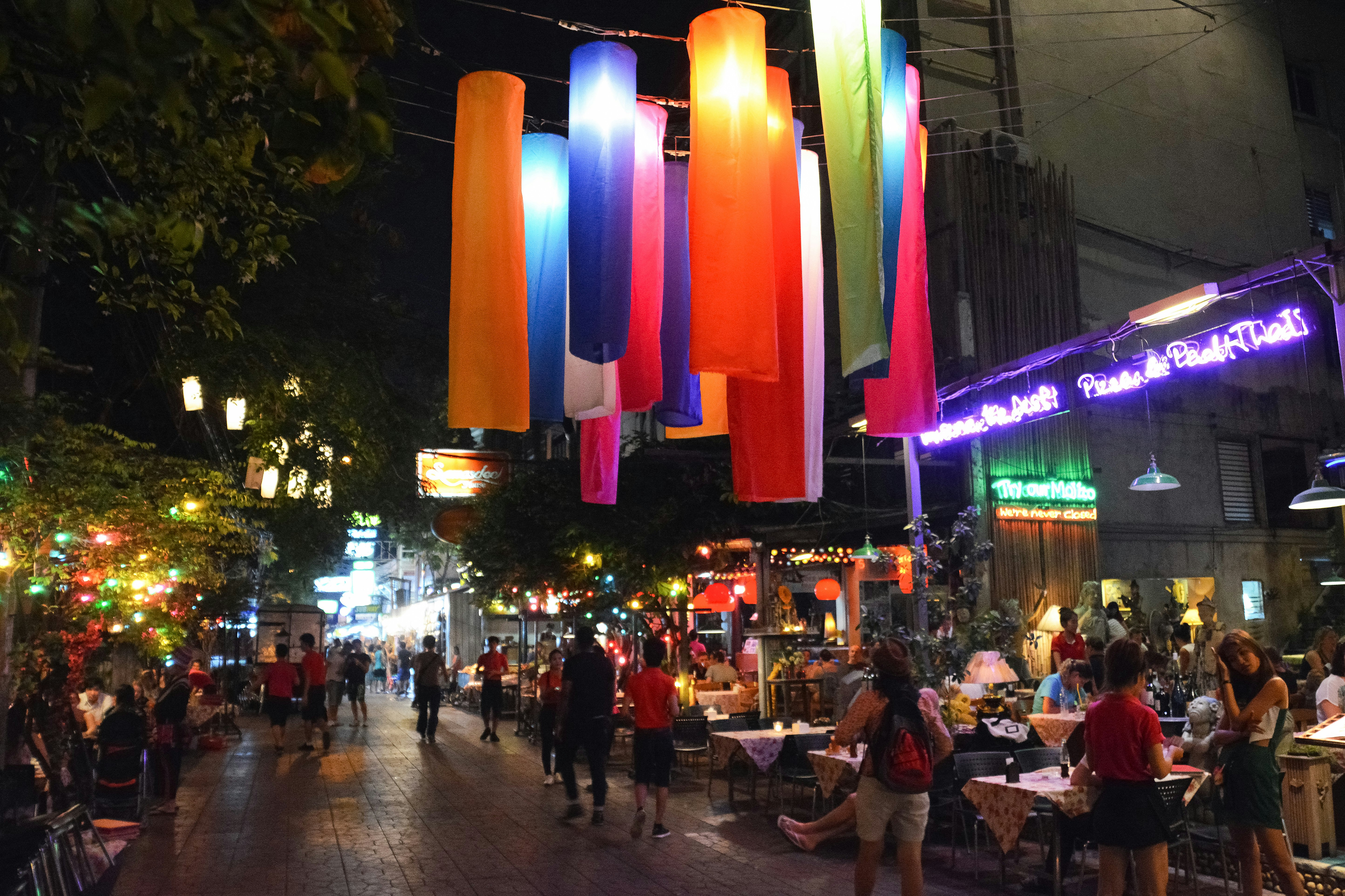 people walking on street during night time